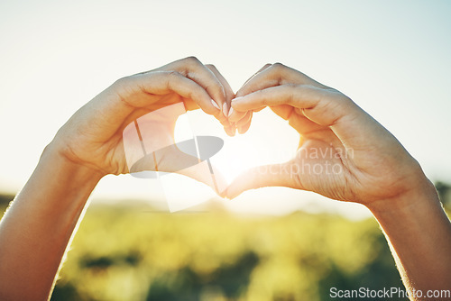 Image of Girl with heart hands, nature and sunshine, sustainability and eco friendly earth care and natural farm landscape. Conservation, sustainable farming and love hand sign emoji, woman with green fingers