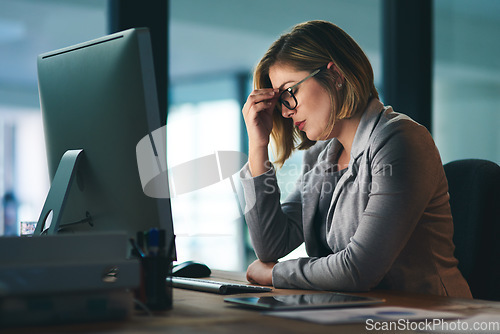 Image of Burnout, stress and business woman in office, fatigue or tired while working late at night on computer. Headache, deadline and female worker with depression, anxiety or brain fog, sick or exhausted.