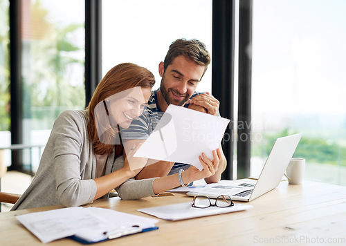 Image of Finance, couple and documents planning budget for tax, bills and savings on laptop with banking, online payment or investment. People, paperwork or happy conversation on financial strategy for growth