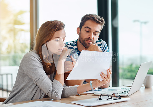 Image of Planning, budget and couple with finance documents for tax, bills and savings on laptop with banking, online payment and investment. People, paperwork and conversation on household financial strategy