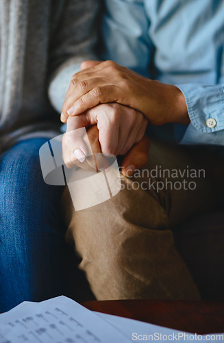 Image of Holding hands, senior couple and closeup of life insurance note with paperwork in living room. Home, sofa and elderly people with empathy, hope and trust with solidarity for bills problem in a lounge