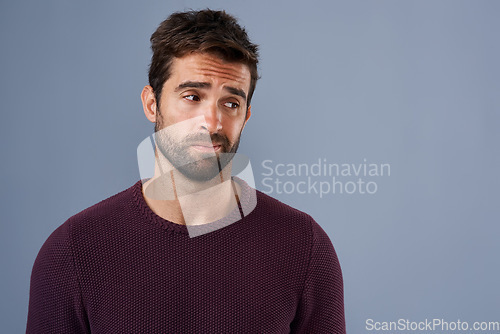 Image of Doubt, thinking and face of man with unsure, uncertain and thoughtful on gray background in studio. Wonder mockup, advertising space and isolated male person worry for decision, choice and question