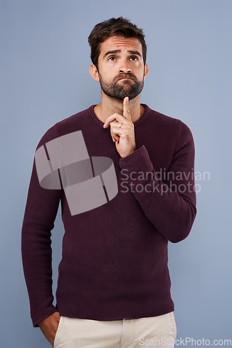 Image of Doubt, thinking and thoughtful man in studio with unsure, uncertain and ideas on gray background. Wondering, mockup space and face of male person with curious pose for decision, choice and question