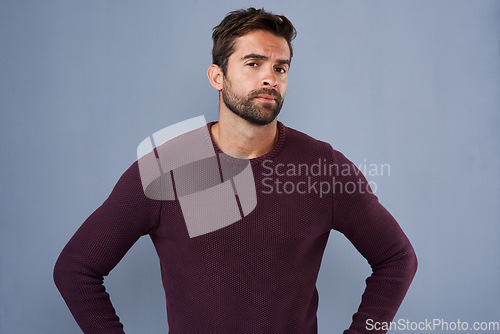 Image of Attitude, thinking and portrait of man in studio with confidence, uncertain and thoughtful on blue background. Confused, mockup space and male person skeptical for decision, choice and question