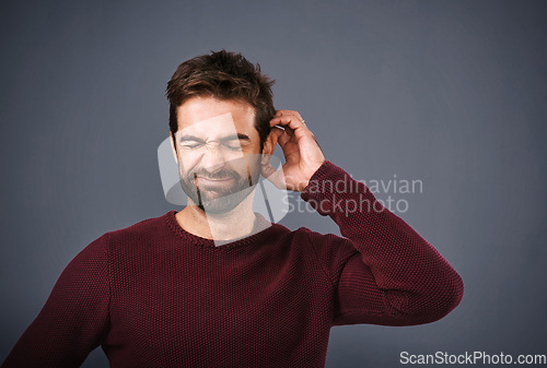 Image of Worry, thinking and face of unsure man in studio with doubt, uncertain and thoughtful on gray background. Confused, mockup space and male person scratch head skeptical for decision, choice and idea