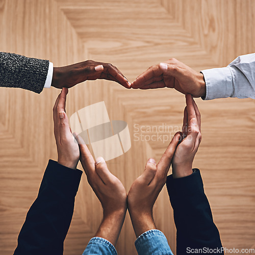 Image of Diversity, heart or hands of business people in support for trust, teamwork or community inclusion in office. Love gesture, above or employees in group collaboration with hope or kindness for charity