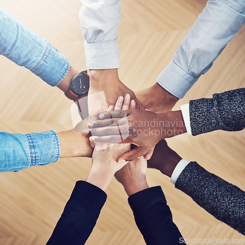 Image of Diversity, partnership or hands of business people in support for faith, teamwork or strategy in office. Closeup, above or employees in group collaboration with hope or mission for goals together