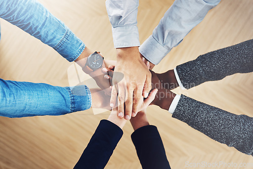 Image of Above, mission or hands of business people in support for faith, teamwork or partnership in office. Vision, diversity or employees in group collaboration with hope or strategy for goals together