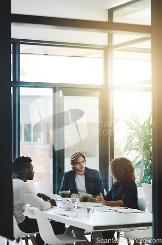 Image of Strategy, teamwork and meeting with business people in boardroom for planning, brainstorming and solution. Corporate, collaboration and conference with employees in office for negotiation development