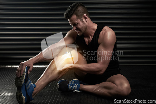 Image of Fitness, knee pain and injury with man in gym for inflammation, muscle and x ray. Medical, workout and accident with male bodybuilder and hurt leg for exercise, emergency and sports problem