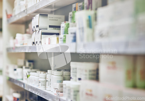 Image of Closeup, pharmacy and medicine with healthcare, pills and shelf with boxes, bottles and treatment. Zoom, medication and package with container, retail and store with pharmaceutical, items or products