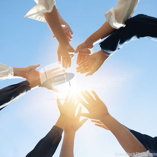 Image of Below hands circle, business people or teamwork by sky background for support, solidarity or goal. Men, women and group with helping hand in air for collaboration, motivation or outdoor team building