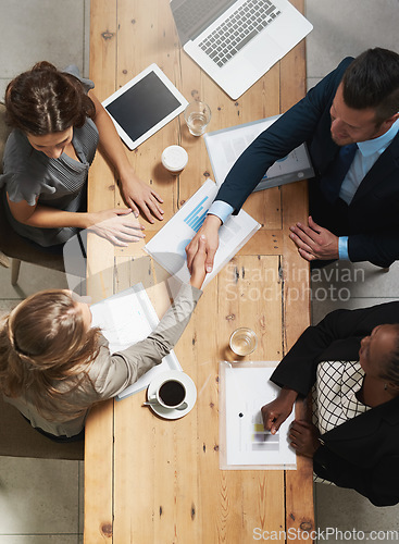 Image of Business meeting, handshake and thank you of partnership deal from top. Collaboration, success and corporate b2b shaking hands of staff with diversity and support in a office with greeting for work