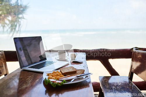 Image of Laptop, beach or empty table at cafe for remote workspace in the morning with wifi connection. Background, internet or luxury seaside coffee shop for travel blog online with brunch meal, tea or food