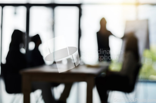Image of Silhouette, presentation and blur of business people in meeting for discussion, planning and conversation. Corporate office, collaboration and men and women for teamwork, communication and workshop