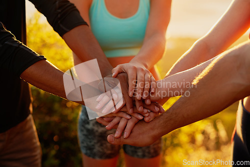 Image of Hands together, fitness friends and outdoor with motivation, workout and teamwork in nature. Exercise, sport and people with hand in sign for support, training and motivation with solidarity and sun