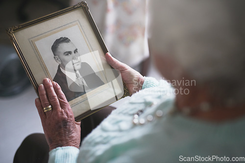 Image of Senior woman, picture frame and memory of husband for nostalgia, history and mourning death. Closeup, elderly and lonely widow with photograph of partner to remember memories, love and grieving