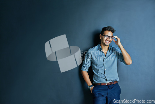 Image of Happy business man, wall background and space with smile, portrait and fashion for entrepreneur in mockup. Excited businessman, holding glasses or smile for career, vision or entrepreneurship mock up