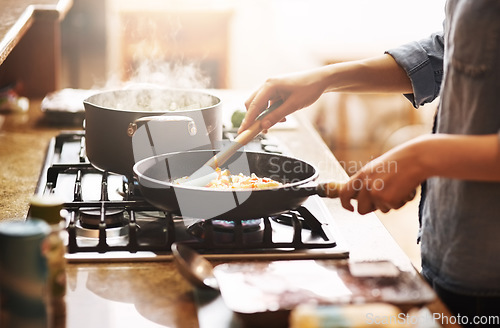 Image of Cooking, kitchen and woman with food in a pan for lunch, dinner or supper in a modern house. Diet, wellness and closeup of a female person preparing a healthy meal in a pot on a stove at her home.