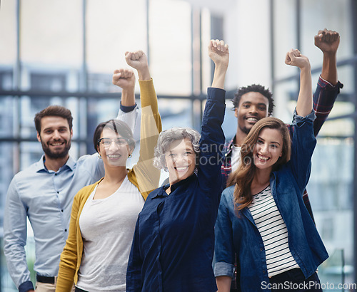 Image of Celebration, diversity and business people with a fist in office for confidence, motivation and teamwork. Happy, smile and group of multiracial corporate employees to celebrate success in workplace.