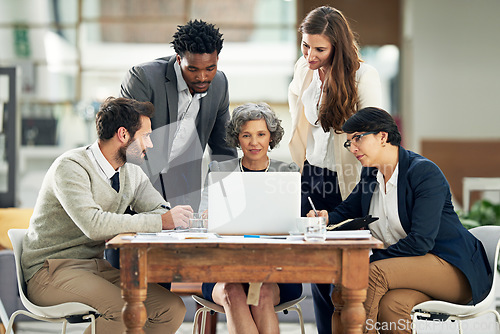 Image of Collaboration, laptop or business people in meeting typing up ideas, strategy or planning a team project. Mentor, manager or employees learning in group coaching with leadership or vision in office