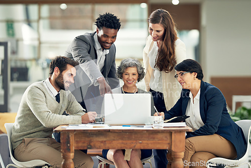 Image of Business people, laptop or black man in meeting discussion for ideas, strategy or planning a project. Digital, teamwork or group of employees pointing or speaking with leadership for growth in office