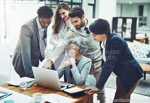 Image of Business people, laptop or man pointing in meeting for ideas, strategy or planning a company project. CEO, teamwork or employees in group discussion or talking with leadership for a vision in office