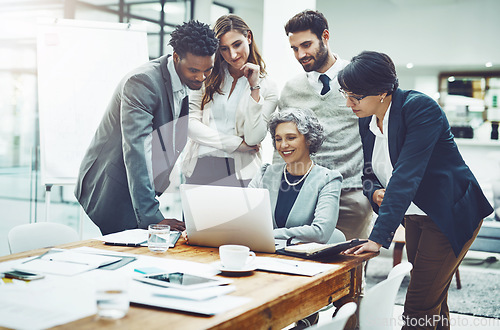 Image of Business people, laptop or woman coaching in meeting typing up ideas, strategy or planning a project. Mentor, teamwork or employees learning in group training with leadership or vision in office