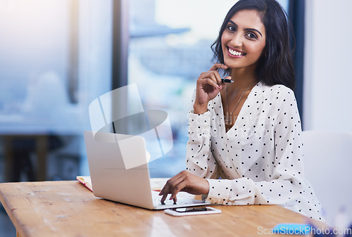 Image of Portrait, employee and Indian woman with a laptop, smile and development for company, business owner and growth. Face, female entrepreneur and consultant with connection, technology and professional