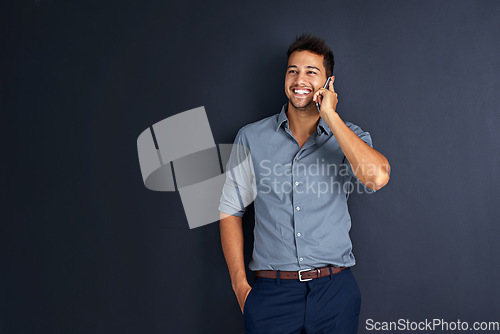 Image of Space, happy and phone call with business man in studio for communication, networking and contact. Connection, smile and conversation with male employee on dark background for mockup and technology