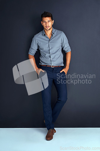 Image of Serious, fashion and portrait of business man in studio for professional, mission and confidence. Pride, mindset and expert with male employee on dark background for entrepreneur, natural and style