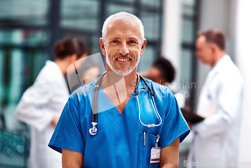 Image of Healthcare, portrait of senior doctor or nurse with smile in hospital, happiness and support in medical career. Health care, confidence and medicine, happy man or nursing professional in workplace.