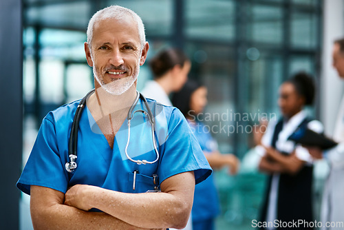 Image of Happiness, portrait of doctor or nurse with mockup in hospital lobby, healthcare and support in medical career. Health care, confidence and medicine, happy man or nursing professional in workplace.