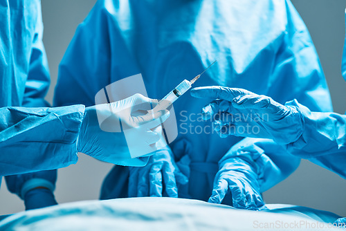 Image of Surgery, operating room and hands of doctor with needle for healthcare, teamwork and professional medicine. Medical innovation, syringe and surgeon with expert staff in hospital icu for operation.