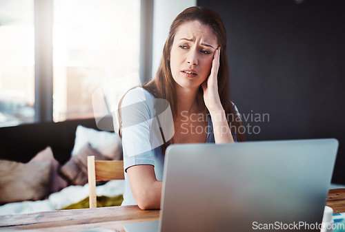 Image of Home office, remote work and woman with stress for a deadline freelance project with a laptop. Burnout, tired and female freelancer with fatigue doing research at her desk or workspace at her house.