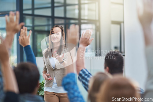 Image of Woman speaker at seminar, audience with hands up for questions and answers at training presentation or meeting. Feedback, opinion and ideas, group of people at conference, hand in air and question.