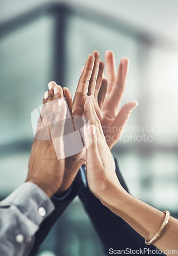 Image of Business people, hands and high five for winning, teamwork or success together at office. Group touching hand in team win, victory or achievement for company goals, unity or solidarity at workplace