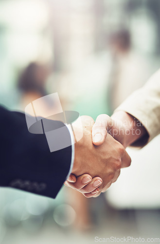 Image of Partnership, deal and business people shaking hands in office after a meeting or interview. Collaboration, team and closeup of corporate employees with handshake for greeting or welcome in workplace.