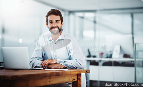 Image of Laptop, confidence and portrait of businessman in the office doing research online on the internet. Technology, corporate and professional male employee working on project with computer in workplace.
