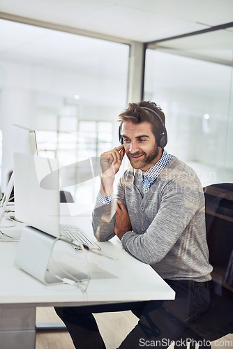 Image of Call center, man and happy talking in office or consultant in conversation with a client, customer support or employee on computer. Contact us, businessman or communication for help, crm or service