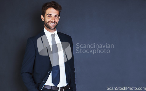 Image of Portrait, mockup and smile with a formal businessman in studio on a blue background for about us corporate style. Success, fashion and a confident male employee in a suit for professional power