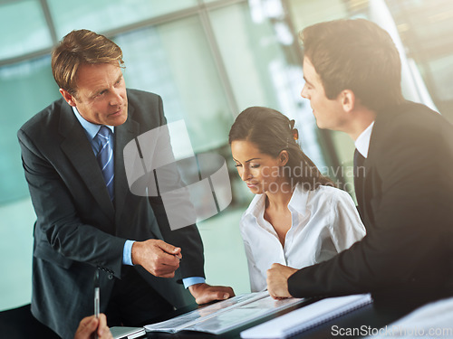 Image of Leader, ceo or discussion review report with team working together in meeting, conversation or documents in conference room. Executive, paperwork and management strategy or company collaboration