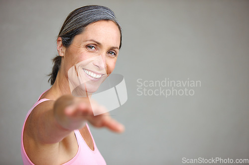 Image of Senior woman, portrait and yoga stretching in studio with mockup space for health, balance and exercise on wall background. Face, meditation and mature lady happy with zen for workout or peace