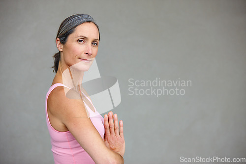 Image of Yoga, portrait and elderly woman in praying pose in studio health, balance and exercise on wall background. Face, meditation and mature lady calm with zen for workout and training on space for mockup