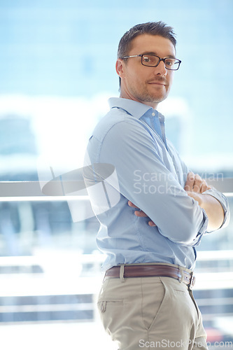 Image of Leader, confidence and portrait of businessman against window proud, mindset and ambitious. Face, ceo and leadership by serious professional, empowered or confident about vision, assertive or tough