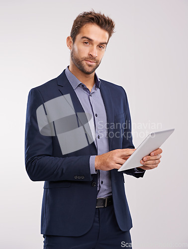 Image of Business man with tablet in portrait, technology and communication for company isolated on studio background. Internet, connectivity and networking, professional male with tech and corporate career