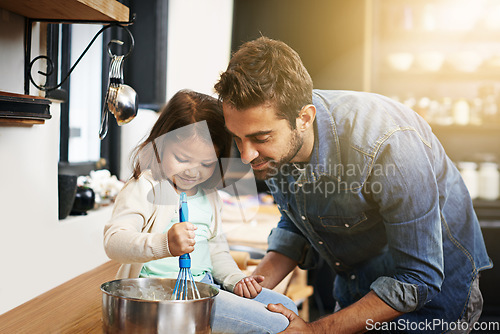 Image of Cooking, food and father with daughter in kitchen for pancakes, bonding and learning. Breakfast, morning and helping with man and young girl in family home for baking, support and teaching nutrition