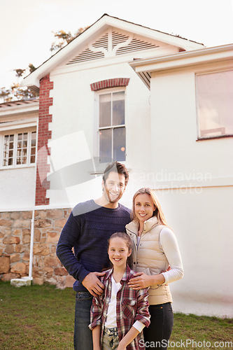 Image of New home, portrait and happy family smile for house, real estate building and property purchase, investment sale and mortgage. Love, homeowner relocation and proud mom, dad and kid standing together