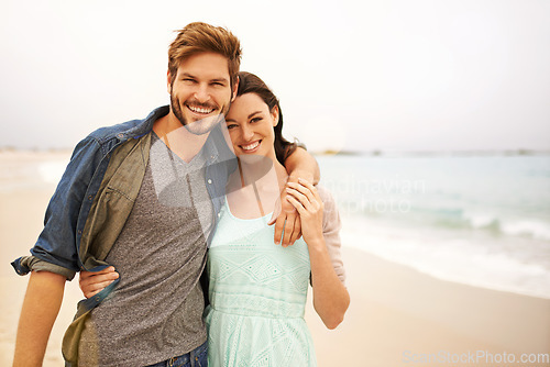 Image of Love, hug and portrait of couple at beach for travel, romance and freedom together outdoors. Face, smile and happy woman embracing man while walking, vacation or holiday, bond and fun in Miami