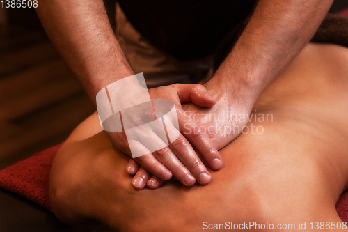 Image of back massage to woman